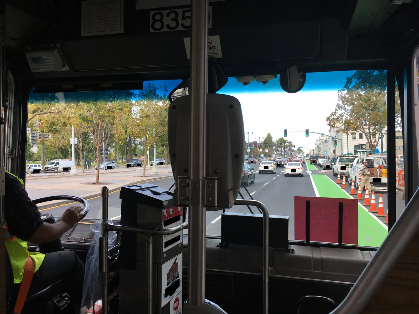 Street scene viewed through a transit coach windshield